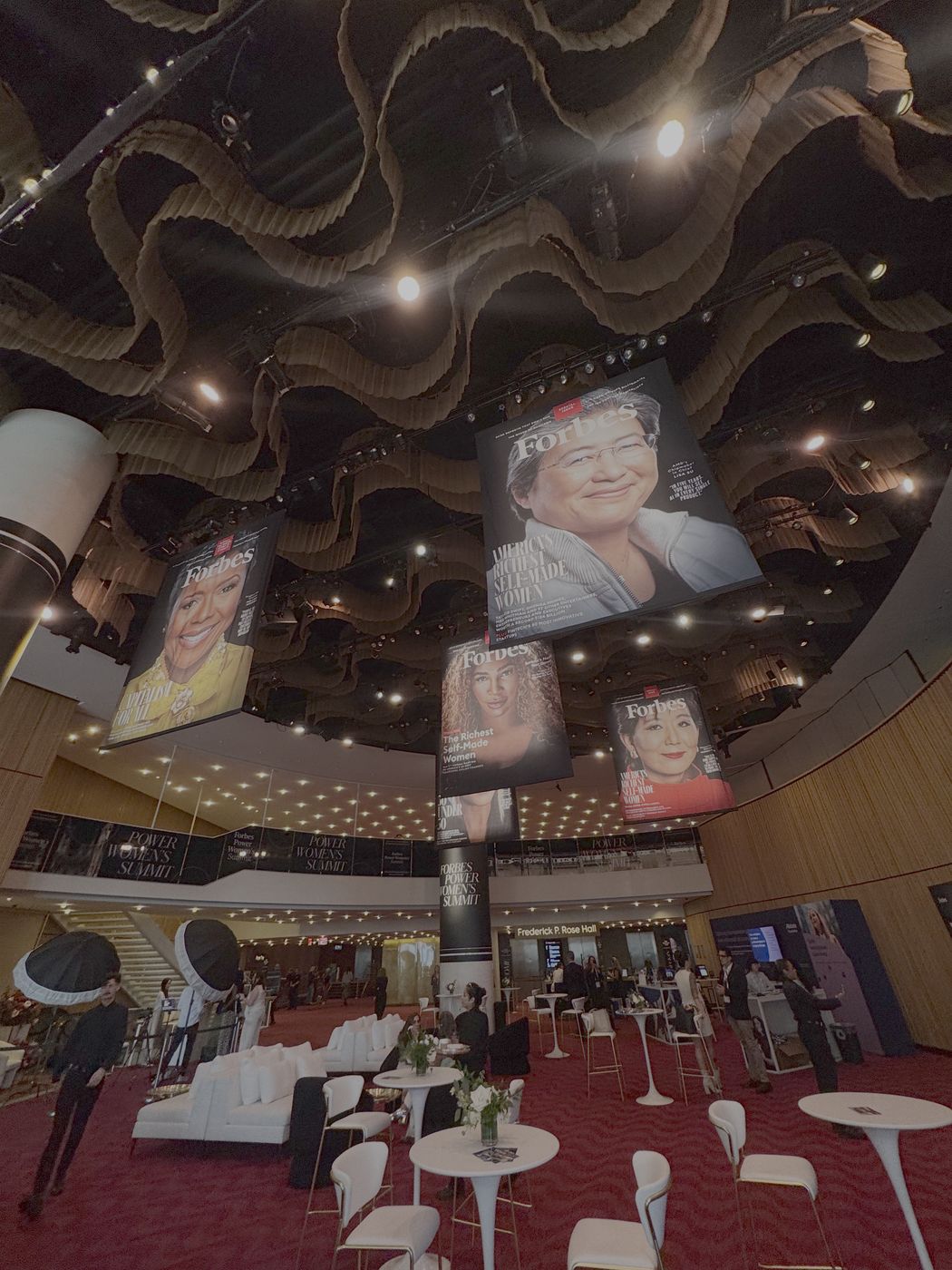 Giant Forbes covers hanging over the Power Women's Summit lobby